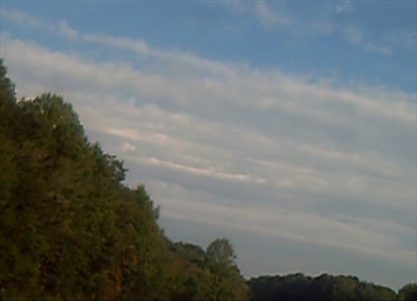 Chemtrails forming parallel lines at a diagonal angle and puffed up and messed together to almost look like a cloud.  